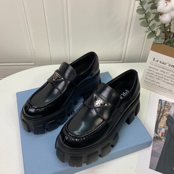 Prada Black Leather Penny Loafers with Silver Logo - Picture 1 of 5